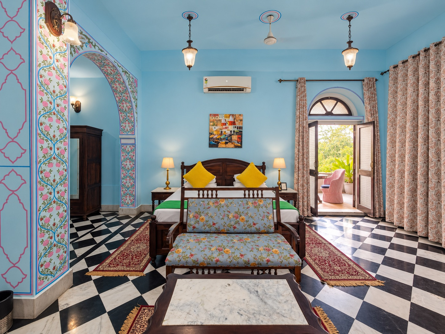 Courtyard Room — pale blue room with painted arch and black and white marble floor