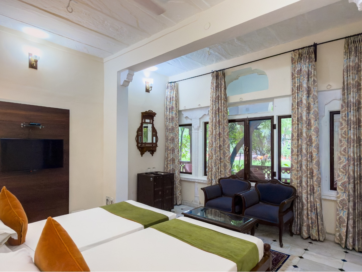 Heritage Standard — twin beds and sitting area with blue armchairs