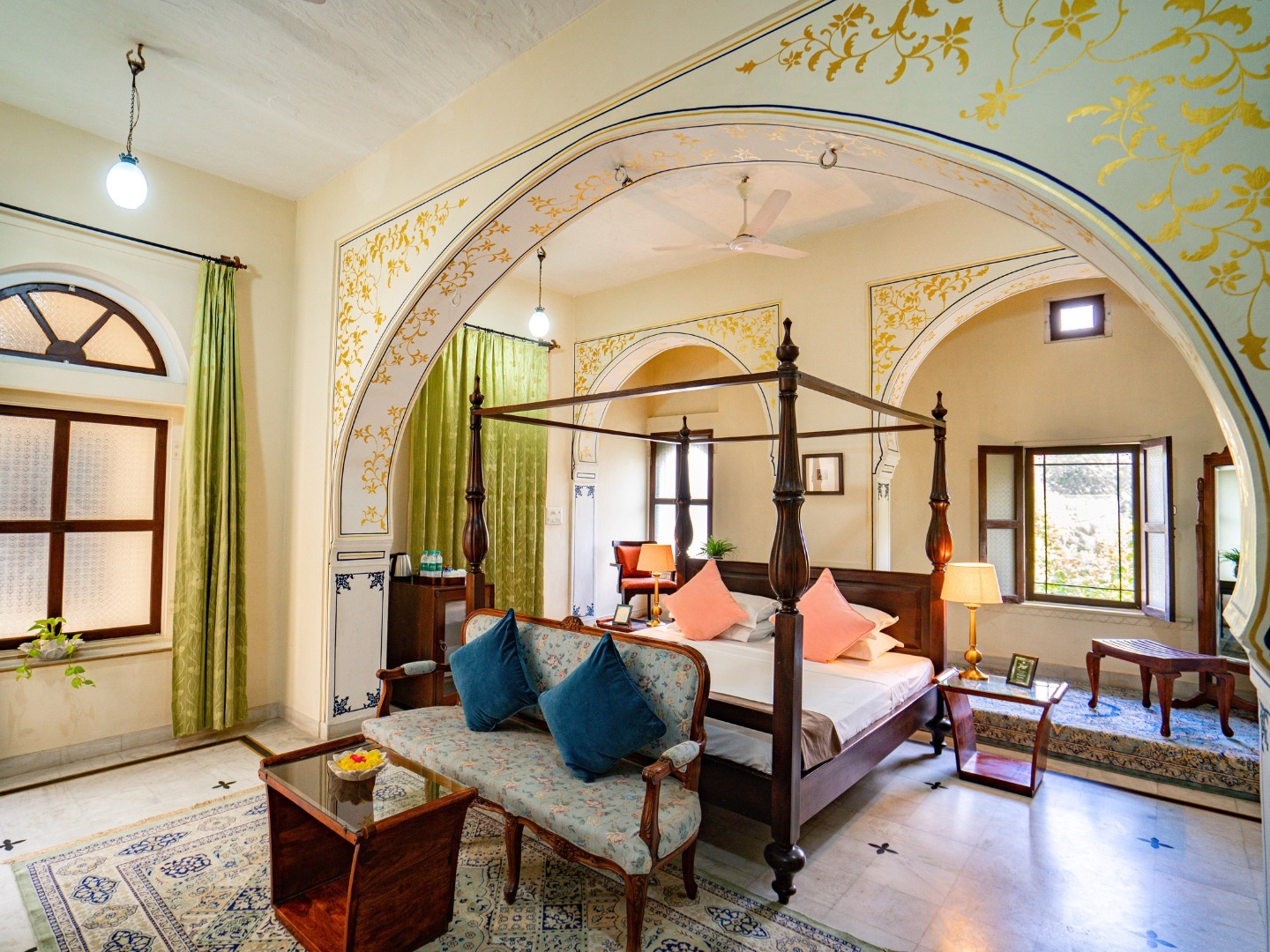 Palace Room — four-poster bed with sofa and fruit bowl
