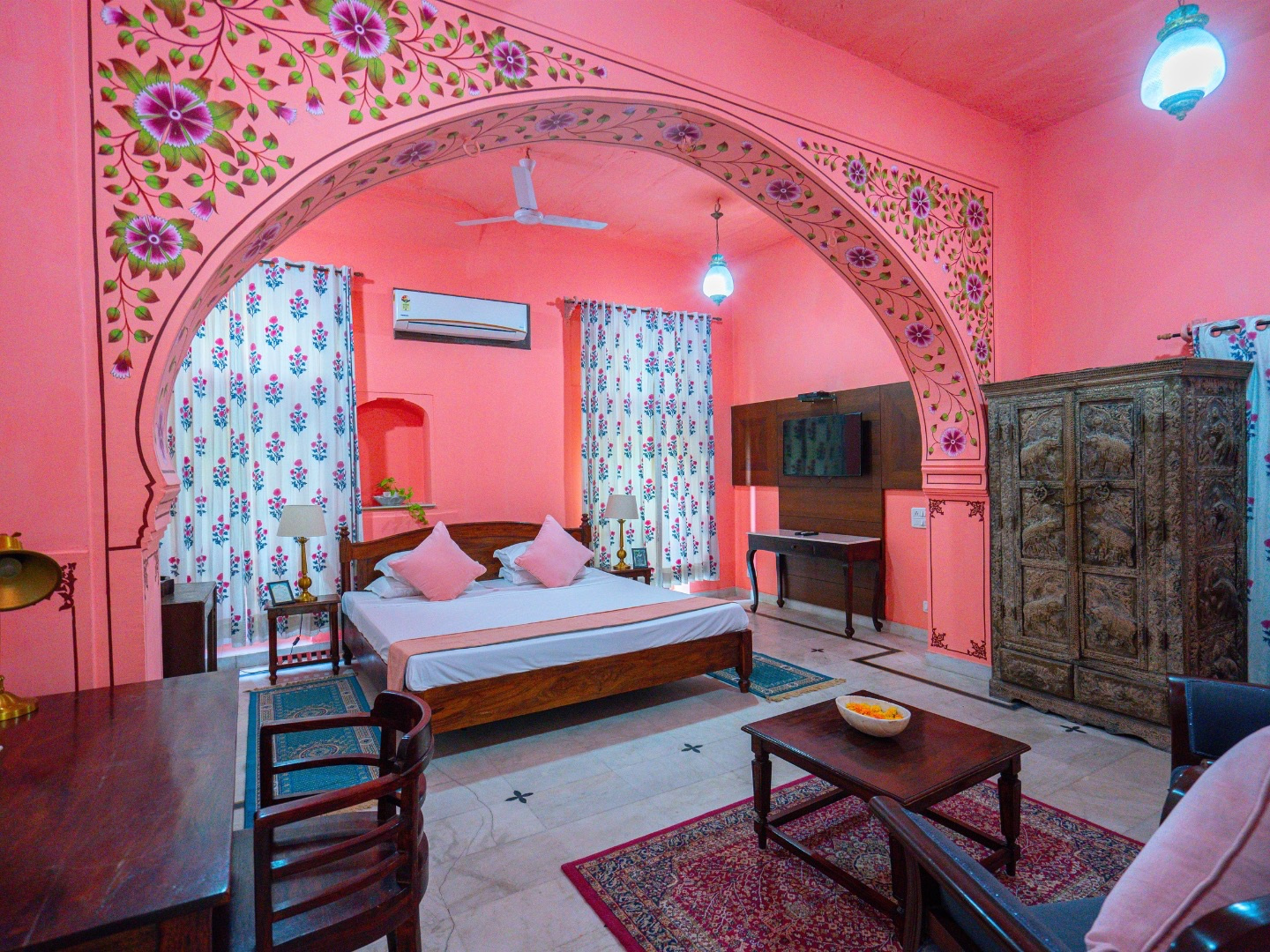 Palace Room — pink painted arch with double bed