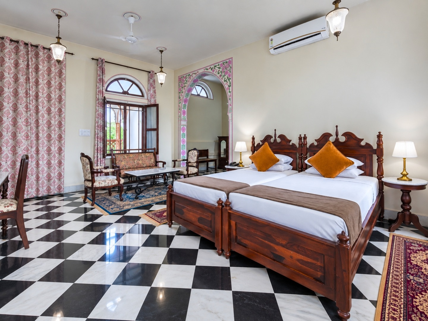 Palace Room — twin beds on a black and white marble floor