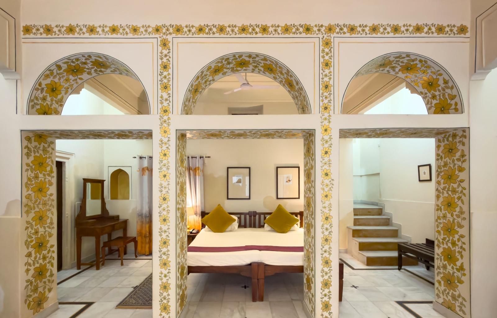 Palace Room — painted arches opening to the bedroom